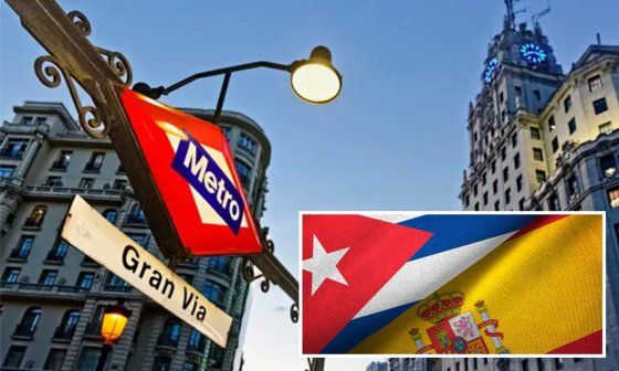 Metro de la Gran Vía en Madrid y banderas de Cuba y España
