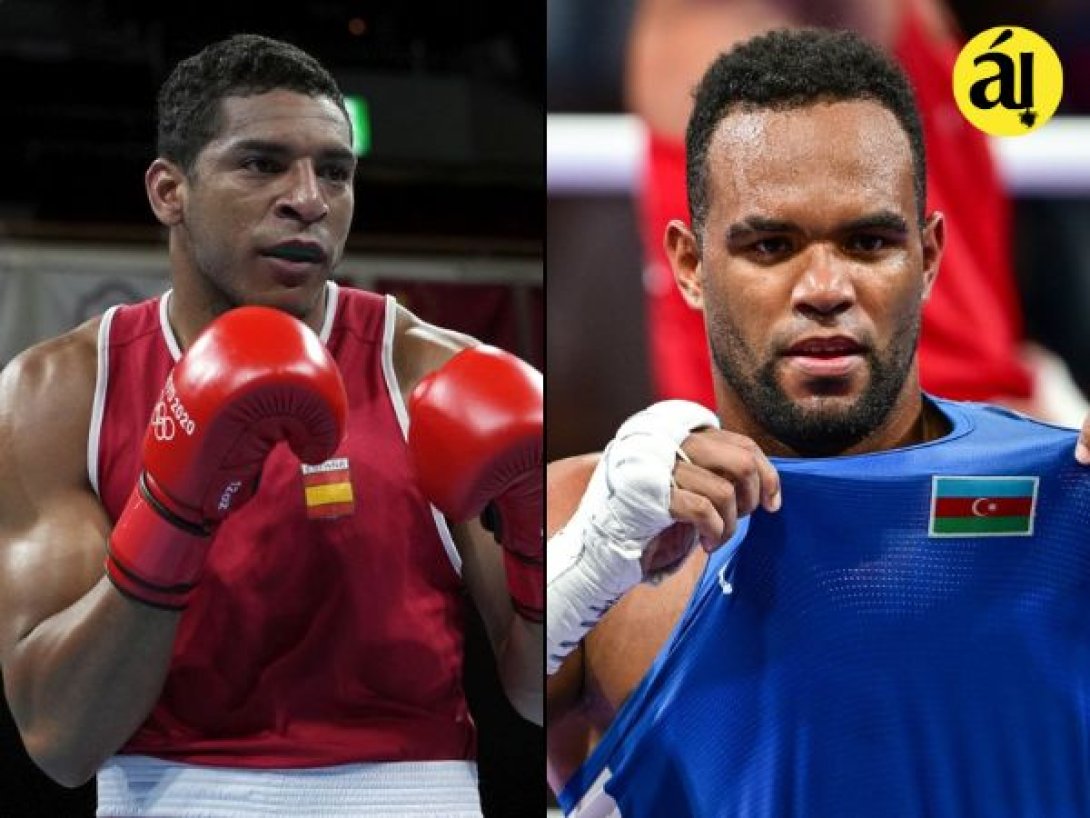 Enmanuel Reyes (España, izquierda) y Loren Berto Alfonso (Azerbaiyán, derecha), boxeadores cubanos