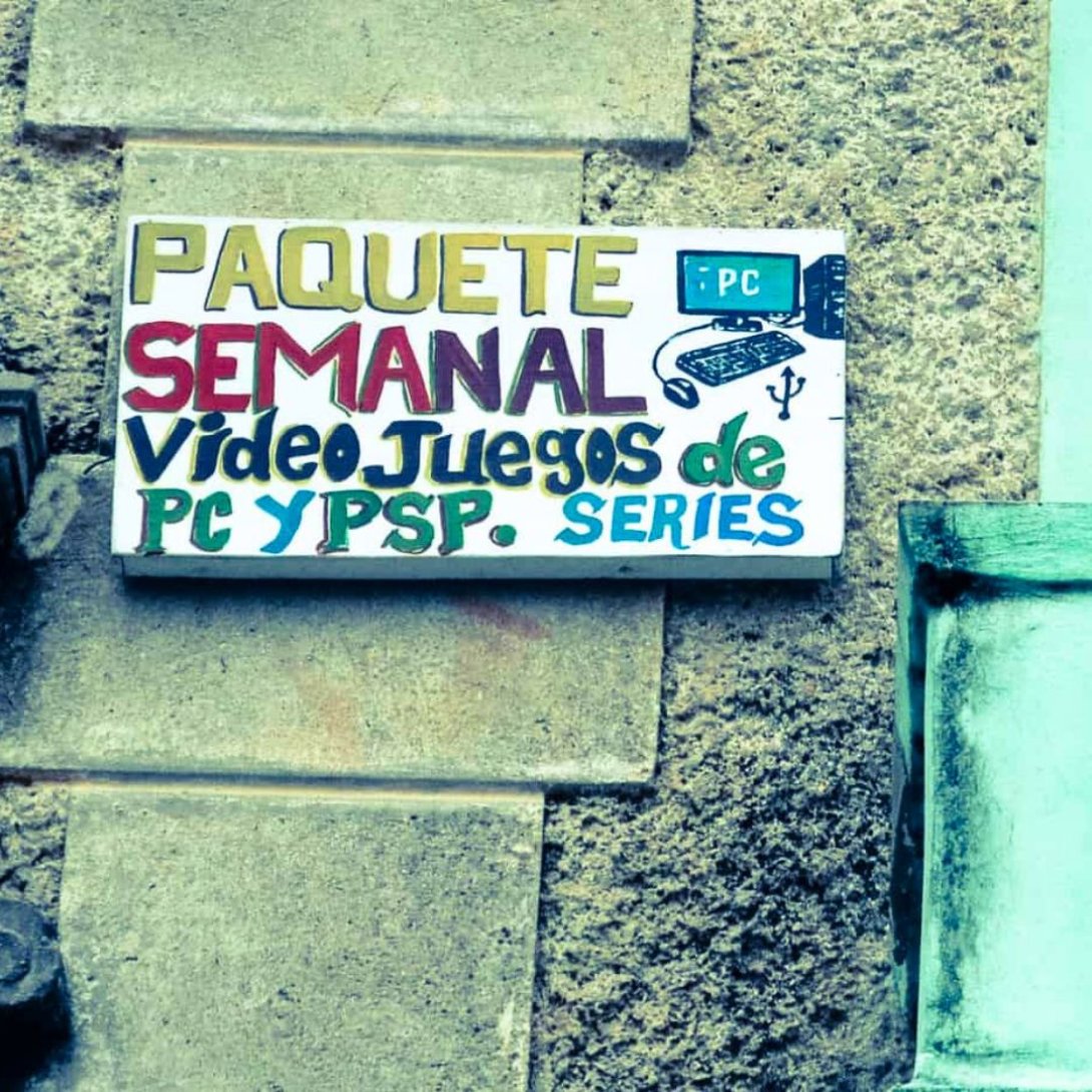 Letrero pintado a mano sobre una pared, promocionando el Paquete Semanal con videojuegos de PC y PSP, y series de televisión.