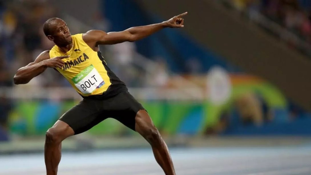 Usain Bolt tras ganar una medalla de oro.