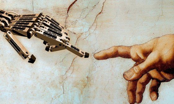 Una mano robótica casi tocando a una humana